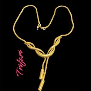 Antique TRIFARI with the crown on top gold.
Pre own